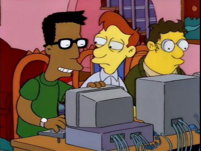 Genios de la computacion sentados frente a computadoras